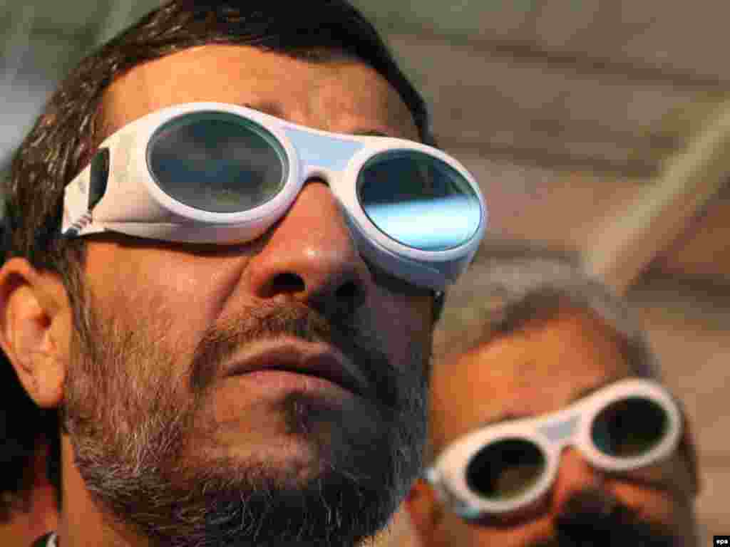 Iranian President Mahmud Ahmadinejad visits a laser technology exhibition in Tehran.