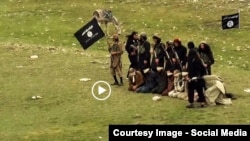 Grab from a video that shows militants loyal to the Islamic State (IS) blowing up bound and blindfolded Afghan prisoners with explosives. The victims were from Nangarhar province.