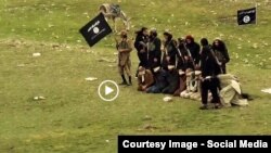 Grab from a video that shows militants loyal to the Islamic State (IS) blowing up bound and blindfolded Afghan prisoners with explosives. The victims were from Nangarhar province.