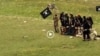 Grab from a video that shows militants loyal to the Islamic State (IS) blowing up bound and blindfolded Afghan prisoners with explosives. The victims were from Nangarhar province.