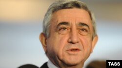 Armenia -- President Serzh Sarkisian votes at a polling station in Yerevan, 18Feb2013.