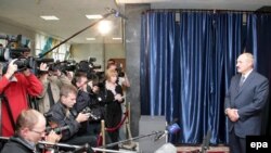 President Alyaksandr Lukashenka talks to media after voting in Minsk