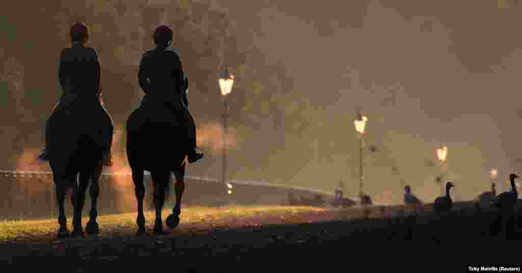 Horse riders on an early-morning morning jaunt in Hyde Park, London, on September 20. (Reuters/Toby Melville)