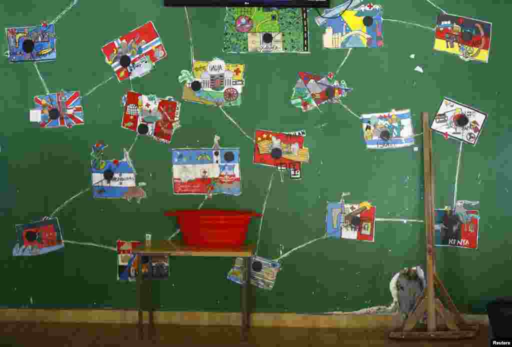 Drawings of national flags are seen in the asylum center in the village of Bogovadja near the Serbian capital Belgrade. 