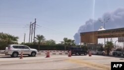 Smoke billows above a damaged oil facility in eastern Saudi Arabia on September 14.