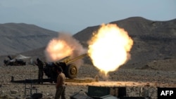 An artillery shell is fired during ongoing clashes between Afghan security forces and militants in Nangarhar.