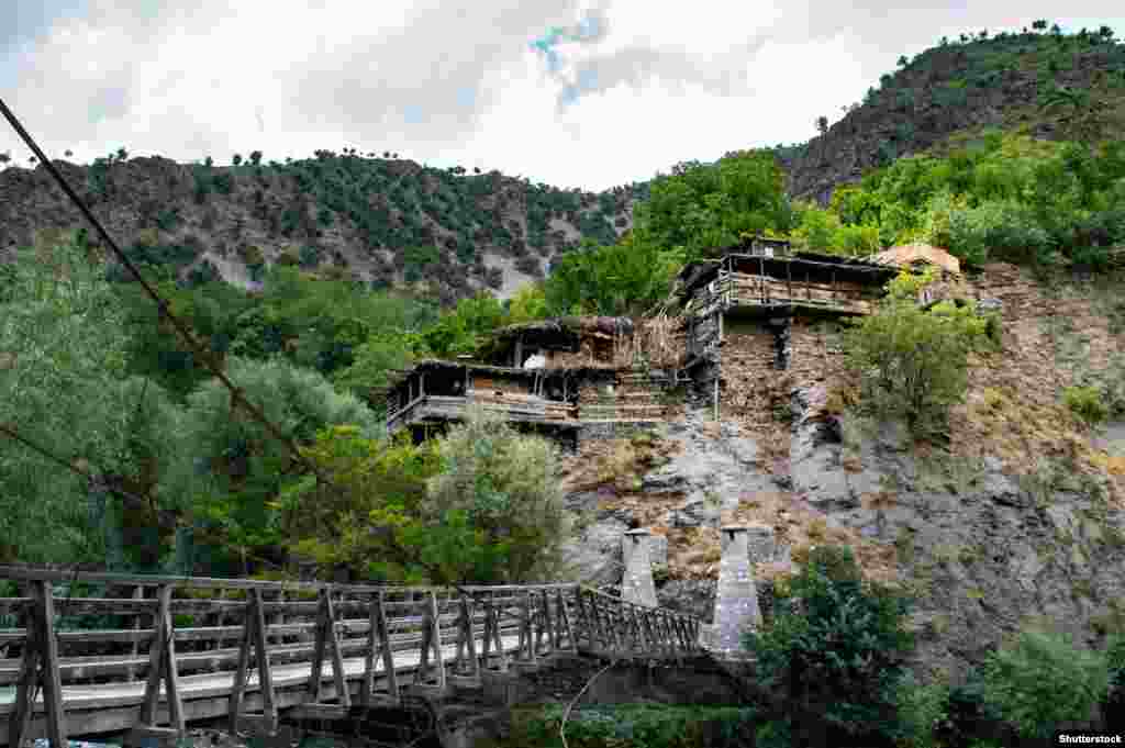 Kalash houses near the frontier with Afghanistan. Across the border, the related Nuristani minority were converted to Islam in the 19th century. (Photo by Shutterstock).