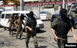 SNB officers take part in an operation to destroy drugs at a metallurgical plant outside Tashkent in June 2015.