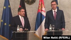 German Foreign Minister Sigmar Gabriel (left) and President-elect and Prime Minister of Serbia Aleksandar Vucic speak to the press in Belgrade on April 12.