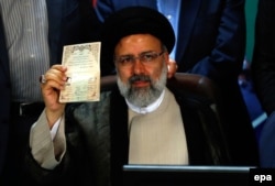 Iranian cleric Ebrahim Raisi registers as a presidential candidate