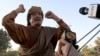 По Каддафи ударили статьей