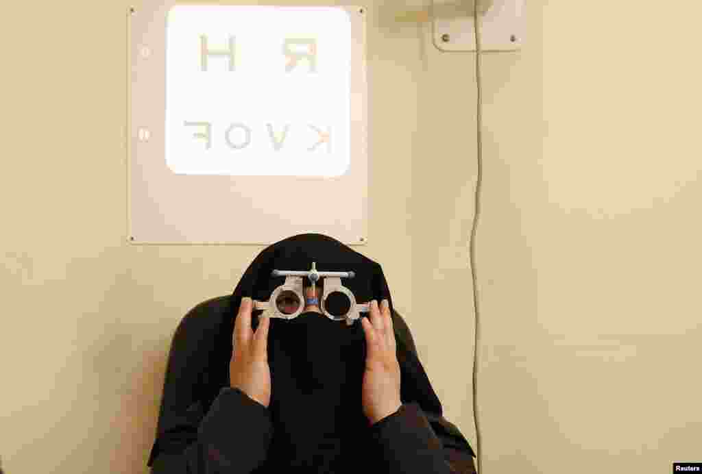 Brenda gets her eyes tested in east London. Brenda, who is originally from Mexico, converted to Islam from Catholicism when she came to London. She has always lived a strictly religious life. She thought about becoming a nun before she realized she wanted children.