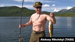 Vladimir Putin was photographed while fishing on a recent break from his presidential duties.