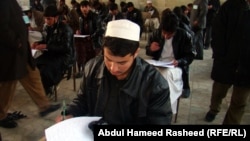 Recent graduates take university entrance exams in Kabul in 2011.