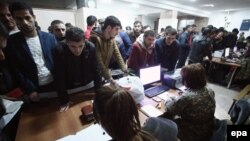 Nagorno-Karabakh -- Armenian men gather in a military commissariat to join the self-defense army of Nagorno-Karabakh in Stepanakert, 2April2016. 