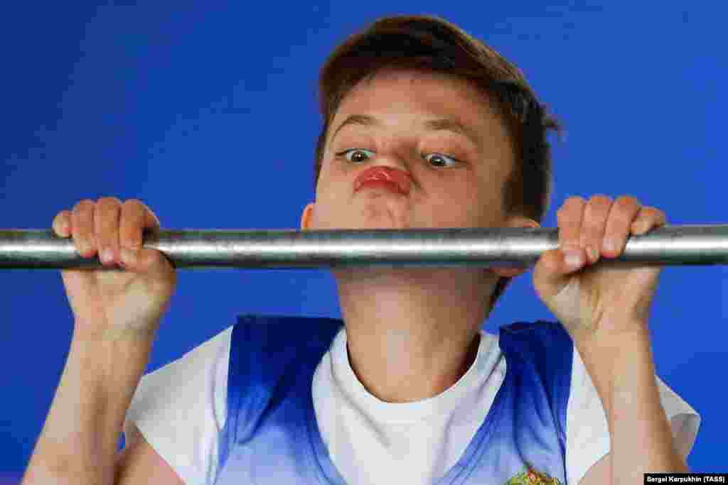 A boy doing chin-ups at the Moscow Suvorov Military School. (TASS/Sergei Karpukhin)