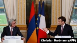 FRANCE -- French President Emmanuel Macron (R) and his Armenian counterpart Serge Sarkisian hold a joint news conference after a meeting at the Elysee Palace in Paris, January 23, 2018