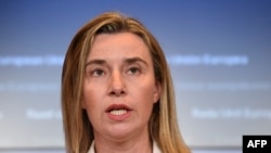 EU foreign policy chief Federica Mogherini says Iran could persuade Syria to take part in UN-led negotiations to end the country's civil war. 