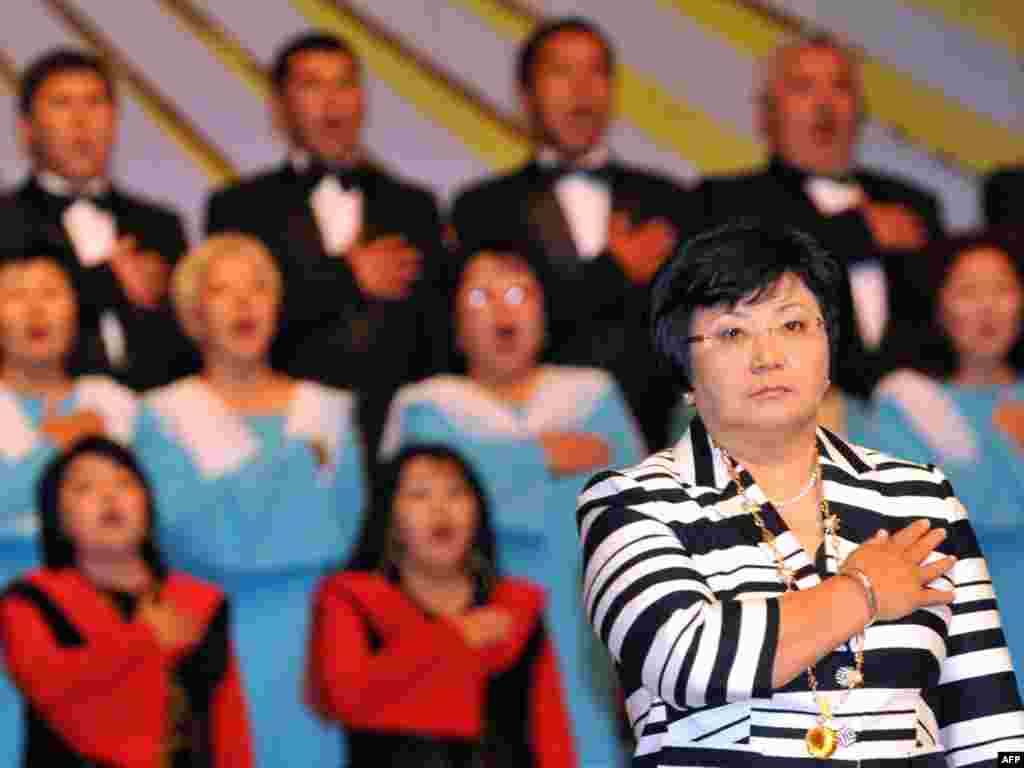 Kyrgyzstan - Roza Otunbaeva stands during her inauguration in Bishkek, 03Jul2010 - KYRGYZSTAN, Bishkek (Ex Frunze) : Roza Otunbaeva stands during her inauguration in Bishkek on July 3, 2010. Kyrgyzstan's provisional leader Roza Otunbayeva has been sworn in as the new president, ushering in what the Central Asian nation's government hopes will be a new era of stability and democratic freedoms. Otunbayeva's first steps are likely to be watched closely by both Russia and the United States, each of which maintains military bases in the strategically-located country. AFP PHOTO / VYACHESLAV OSELEDKO 10poty