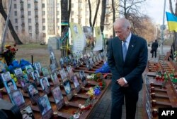 U.S. Vice President Joe Biden pays his respects to those antigovernment demonstrators known as the "Heavenly Hundred" at a monument dedicated to them in Kyiv on December 7.