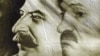 A poster with portraits of Josef Stalin (left) and Alyaksandr Lukashenka seen at a protest rally in May.