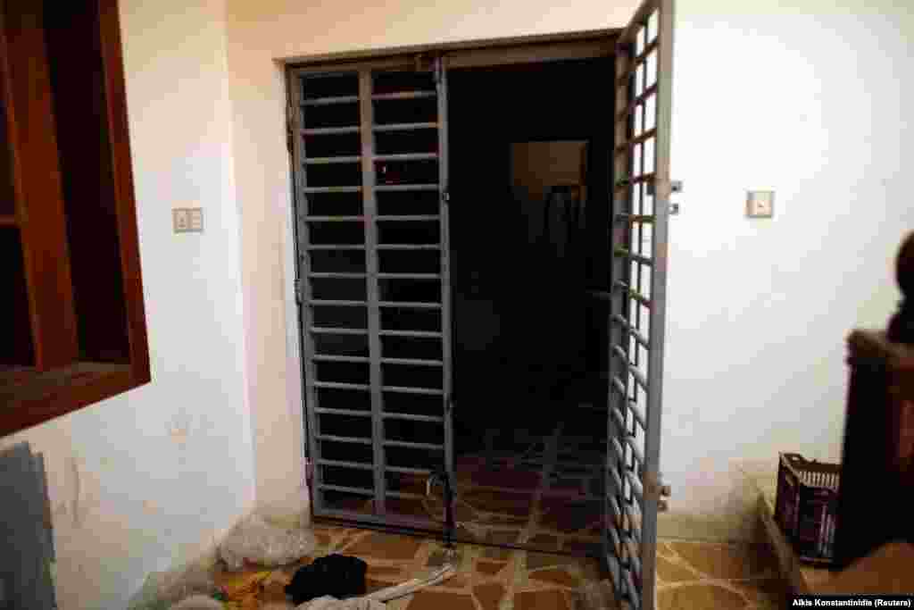 A steel gate opens to the hidden prison abandoned by the extremists. The prison was reportedly used to hold captured Iraqi soldiers and members of the Yazidi religious minority. 