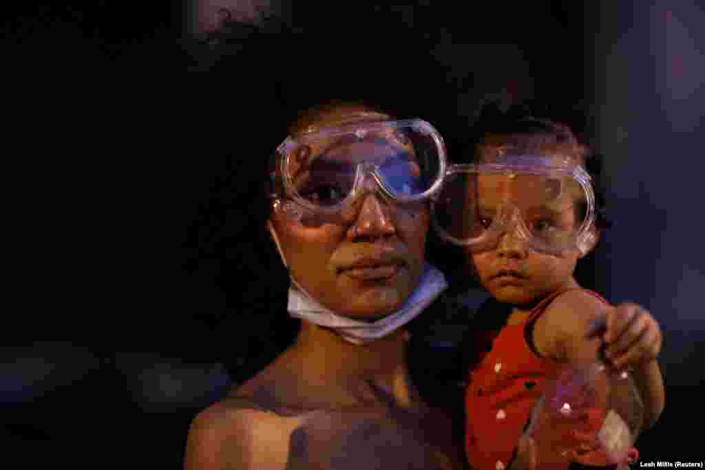 Twana and her baby Bonita pose for a portrait near the White House as racial inequality protests continue, in Washington, U.S., June 23, 2020.