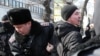 KAZAKHSTAN -- Policemen detain a man during a rally held by opposition supporters in Almaty-Nur Otan, February 27, 2019