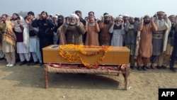 Relatives and residents offer funeral prayers for victims of the Bacha Khan university attack in in Charsadda on January 21.