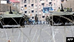 Armored vehicles patrol the streets of Yerevan on March 2, 2008.