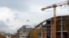 A new concert hall is under construction (right) next to the newly completed offices of the public prosecutor and financial police (center).