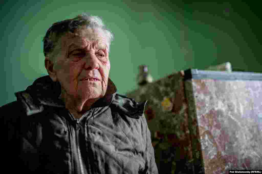 Katerina Moroz, 78, in her damaged house 