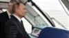 Amid Western Condemnation, Putin Opens Crimea Bridge To Rail Traffic