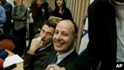 Acting chairman of the Likud Tzahi Hanegbi, shakes hands with an unidentified supporter before a meeting of the Likud faction in the Knesset, Israel's parliament, Monday Nov. 21, 2005 (AP Photo/Oded Balilty)