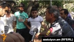 Armenia - Armenian police chief Vladimir Gasparian (R) talks to young protesters on Marshal Bagramian Avenue, Yerevan, 30Jun2015