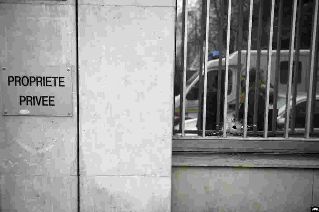 A bullet hole is seen on a window after the massacre at the Paris offices of the satirical weekly Charlie Hebdo in Paris on January 7. Gunmen stormed the offices, killing 12 people. (AFP/Martin Bureau)