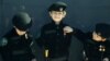 A Chechen boy wears a military uniform decorated with medals at an award ceremony of officers and soldiers of special police forces who distinguished themselves in defense of the parliament building during an attack by a group of militants on October 19, at the parade ground of cadet corps in Grozny on November 3.<br /><br />Photo by Viskham Magomadov for AFP