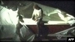 U.S. -- A CBS News image shows Dzhokhar Tsarnaev, a suspect in the Boston Marathon bombing, after he was found hiding in a boat in a Boston suburb, 19Apr2013