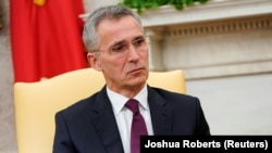 NATO Secretary General Jens Stoltenberg listens while meeting with U.S. President Donald Trump in the Oval Office at the White House in Washington on April 2.