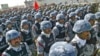 Iraqi security officers parade in the city of Najaf.