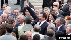 Armenia - Prosperous Armenia Party leader Gagik Tsarukian (C) waves to a friend during the opening of a church built by him in Abobvian, 14May2013.