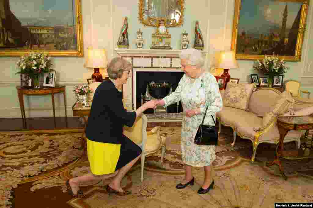 Britain&#39;s Queen Elizabeth welcomes Theresa May at the start of an audience in Buckingham Palace, where the monarch formally invited her to become Prime Minister, in London on July 13. (Reuters/Dominic Lipinski)