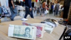 President Hassan Rohani says that the exchange rates of the rial against foreign currencies "will not remain at current levels."