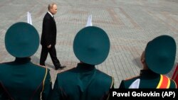 Russian President Vladimir Putin attends a wreath-laying ceremony at the Tomb of the Unknown Soldier after the military parade marking the victory in World War II in Moscow on May 9, 2019.