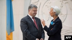 Президент України Петро Порошенко і директор-розпорядник МВФ Крістін Лаґард. Вашингтон, 20 червня 2017 року