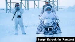 Russian servicemen guard an area at the Nagurskoye military base in Alexandra Land on the remote Arctic islands of Franz Josef Land in March 2017.