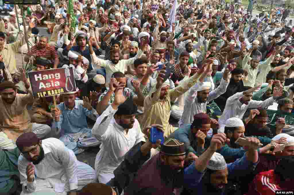 Supporters of Tehrik-e-Labaik Pakistan (TLP), a hard-line religious political party, chant slogans during a protest against a Supreme Court decision to overturn the conviction of a Christian woman, Asia Bibi, in Lahore on October 31. Bibi is a Christian mother who was facing execution for blasphemy against Islam. (AFP/Arif Ali)