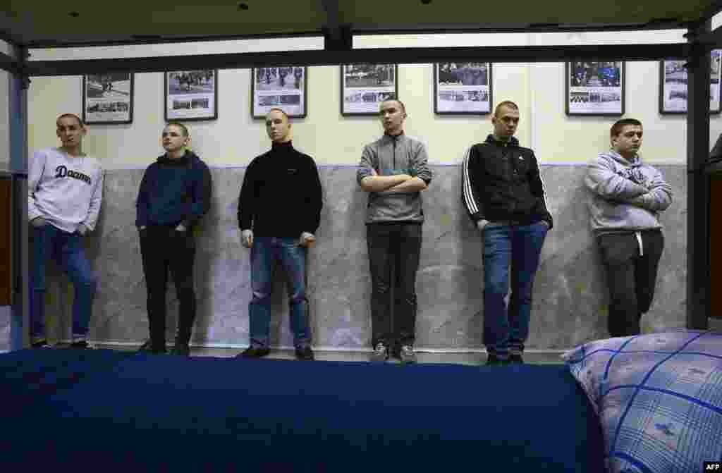 Russian conscripts wait at a military registration and enlistment office in St. Petersburg. (AFP/Olga Maltseva)