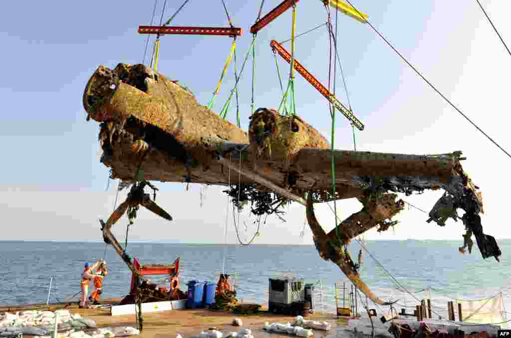 The wreck of a German World War II Dornier Do-17 is raised to the surface of a ship at Goodwin Sands, Kent, at the mouth of the English Channel. The aircraft was shot down during the Battle of Britain in 1940. The operation to retrieve it was the biggest of its kind in British waters, the museum said. (AFP)