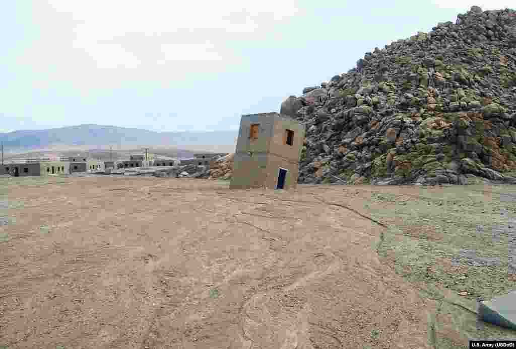 Storms in September 2013 swept through the Fort Irwin site, toppling a Medina Jabal structure filling some of the buildings with up to four feet of mud.